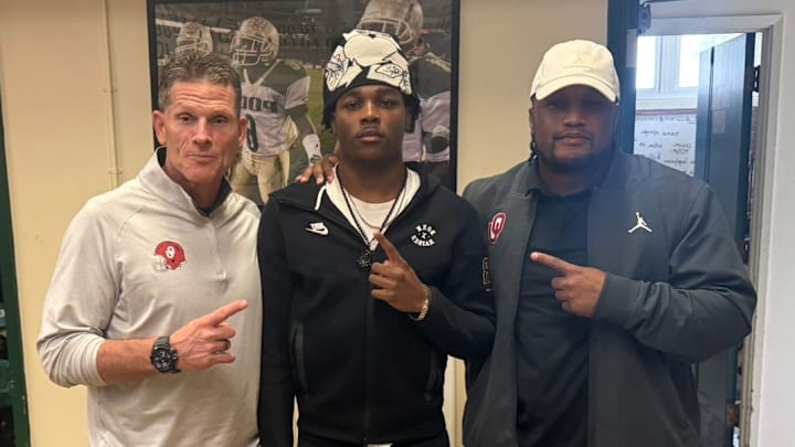 Oklahoma coach Brent Venables, target JuJu Johnson and defensive analyst Xavier Brewer.