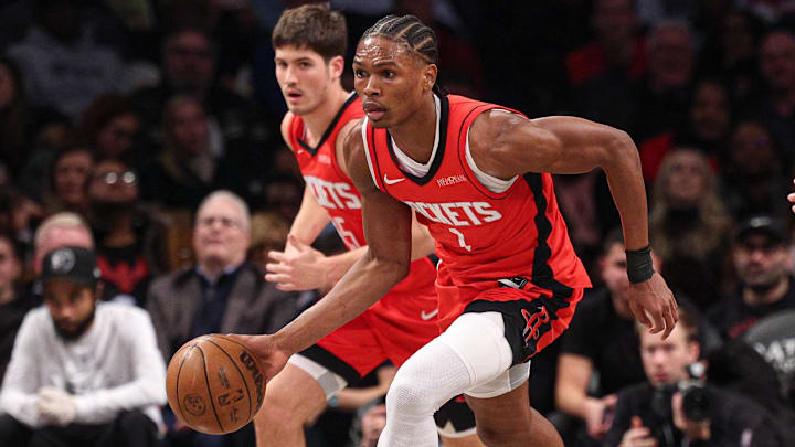 Feb 4, 2025; Brooklyn, New York, USA; Houston Rockets forward Amen Thompson (1) dribbles up court during the first half against the Brooklyn Nets at Barclays Center. Mandatory Credit: Vincent Carchietta-Imagn Images