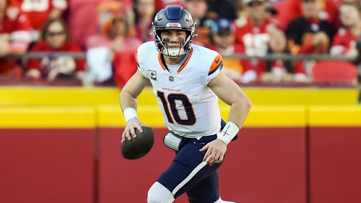 Nov 10, 2024; Kansas City, Missouri, USA; Denver Broncos quarterback Bo Nix (10) rolls out to pass during the second half against the Kansas City Chiefs at GEHA Field at Arrowhead Stadium. 