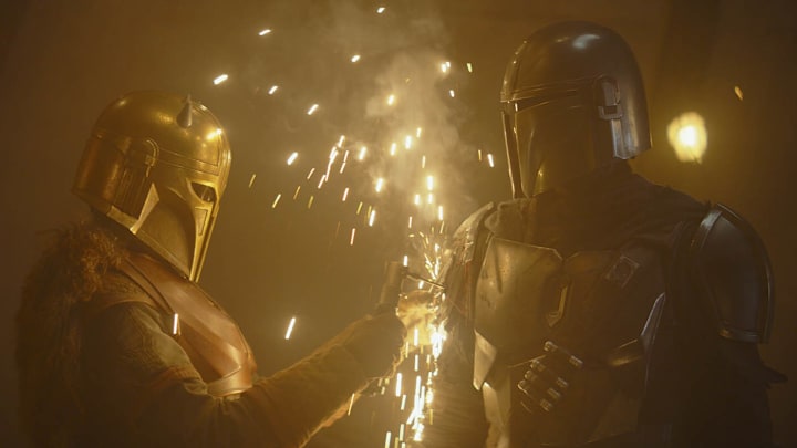 The Armorer (Emily Swallow) and Din Djarin (Pedro Pascal) in Star Wars The Mandalorian "Chapter 8: Redemption." Image Credit: starwars.com