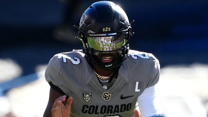 Nov 11, 2023; Boulder, Colorado, USA; Colorado Buffaloes quarterback Shedeur Sanders (2) at the line of scrimmage in the first half against the Arizona Wildcats at Folsom Field. Mandatory Credit: Ron Chenoy-Imagn Images