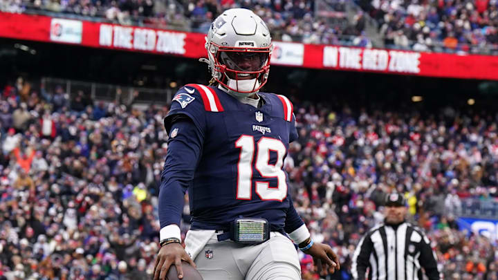Jan 5, 2025; Foxborough, Massachusetts, USA; New England Patriots quarterback Joe Milton III (19) runs the ball for a touchdown against the Buffalo Bills in the first quarter at Gillette Stadium. Mandatory Credit: David Butler II-Imagn Images