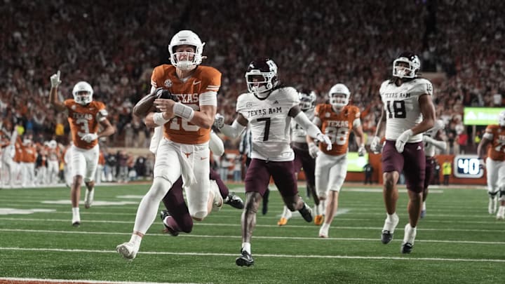 Texas Longhorns quarterback Arch Manning keeps the ball and runs for a touchdown during the second half against the Texas A&M Aggies at Darrell K Royal-Texas Memorial Stadium. Mandatory Credit: Scott Wachter-Imagn Images