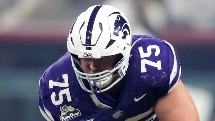 Dec 26, 2024; Phoenix, AZ, USA; Kansas State Wildcats offensive lineman Sam Hecht (75) against the Rutgers Scarlet Knights during the Rate Bowl at Chase Field. Mandatory Credit: Mark J. Rebilas-Imagn Images