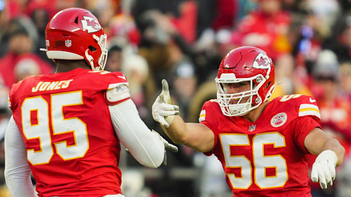Nov 29, 2024; Kansas City, Missouri, USA; Kansas City Chiefs defensive end George Karlaftis (56) celebrates with defensive tackle Chris Jones (95) after a sack during the second half against the Las Vegas Raiders at GEHA Field at Arrowhead Stadium. Mandatory Credit: Jay Biggerstaff-Imagn Images