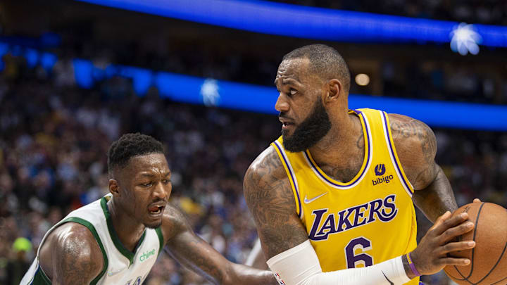 Dec 15, 2021; Dallas, Texas, USA; Dallas Mavericks forward Dorian Finney-Smith (10) and Los Angeles Lakers forward LeBron James (6) in action during the game between the Dallas Mavericks and the Los Angeles Lakers at the American Airlines Center. Mandatory Credit: Jerome Miron-Imagn Images