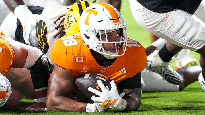 Sep 19, 2026; Knoxville, Tennessee, USA;  Tennessee running back DeSean Bishop (18) looks up after landing in the end zone for a touchdown during Tennesseea?TMs college football game against Kennesaw State at Neyland Stadium in Knoxville on Sept. 19, 2026.  Mandatory Credit: Caitie McMekin/News Sentinel-USA TODAY NETWORK via Imagn Images