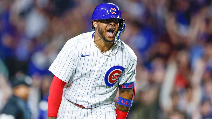 Apr 11, 2023; Chicago, Illinois, USA; Chicago Cubs center fielder Nelson Velazquez (4) reacts after hitting a grand slam against the Seattle Mariners during the third inning at Wrigley Field. Mandatory Credit: Kamil Krzaczynski-USA TODAY Sports