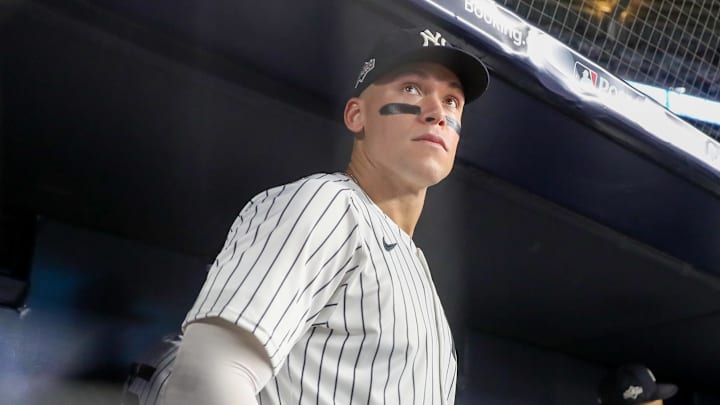Oct 7, 2025; Bronx, New York, USA; New York Yankees outfielder Aaron Judge (99) looks on in the dugout prior to the game against the Toronto Blue Jays during game three of the ALDS round for the 2025 MLB playoffs at Yankee Stadium. Mandatory Credit: Wendell Cruz-Imagn Images