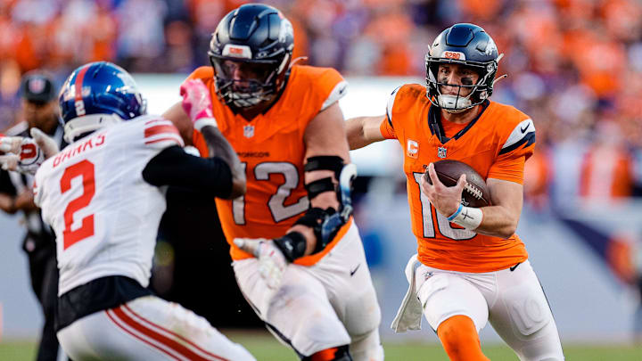 Oct 19, 2025; Denver, Colorado, USA; Denver Broncos quarterback Bo Nix (10) runs for a touchdown as offensive tackle Garett Bolles (72) defends against New York Giants cornerback Deonte Banks (2) in the fourth quarter at Empower Field at Mile High. Oct 19, 2025; Denver, Colorado, USA; Denver Broncos quarterback Bo Nix (10) runs for a touchdown as offensive tackle Garett Bolles (72) defends against New York Giants cornerback Deonte Banks (2) in the fourth quarter at Empower Field at Mile High.