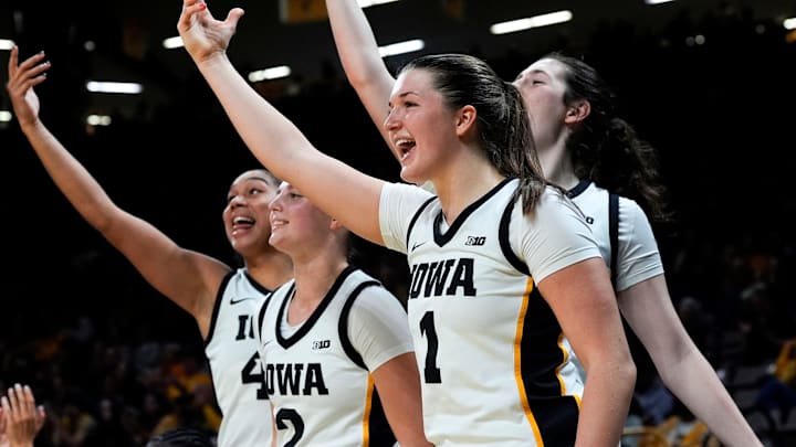 Iowa forward Hannah Stuelke (45), Iowa guard Taylor McCabe (2), Iowa guard Taylor Stremlow (1) and Iowa center Ava Heiden (5) react Nov. 26, 2025 at Carver-Hawkeye Arena in Iowa City, Iowa.
