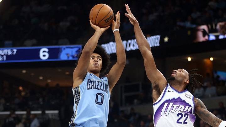 Oct 21, 2026; Memphis, Tennessee, USA;  Memphis Grizzlies forward Jaylen Wells (0) shoots against Utah Jazz guard Darryn Peterson (22) during the first quarter at FedExForum.  Mandatory Credit: Petre Thomas-Imagn Images