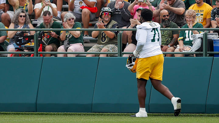 Green Bay Packers offensive tackle Anthony Belton (71) pumps up fans at practice during the first day of training camp on Wednesday, July 23, 2025, at Ray Nitschke Field in Ashwaubenon, Wis.