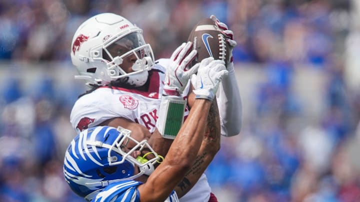 Memphis' Marcello Bussey (6) has the ball pulled out of his hands by Arkansas' Julian Neal (23) during the game between Memphis and Arkansas at Simmons Bank Liberty Stadium in Memphis, Tenn., on September 20, 2025.