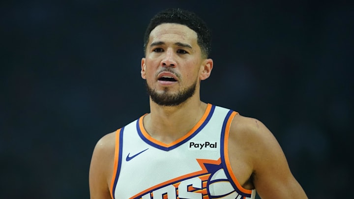 Nov 18, 2025; Portland, Oregon, USA; Phoenix Suns guard Devin Booker (1) looks on during the first half against the Portland Trail Blazers at Moda Center. Mandatory Credit: Soobum Im-Imagn Images