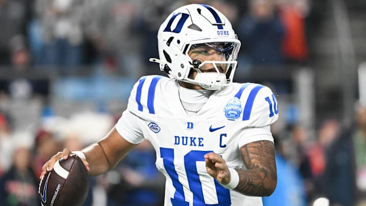 Dec 6, 2025; Charlotte, NC, USA; Duke Blue Devils quarterback Darian Mensah (10) looks to throw in the second quarter against the Virginia Cavaliers during the 2025 ACC Championship game at Bank of America Stadium. Mandatory Credit: Bob Donnan-Imagn Images
