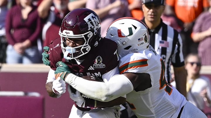 Miami Hurricanes defensive lineman Rueben Bain Jr. (4) tackles Texas A&M Aggies wide receiver KC Concepcion (7) during the game between the Aggies and the Hurricanes at Kyle Field. Mandatory Credit: Jerome Miron-Imagn Images