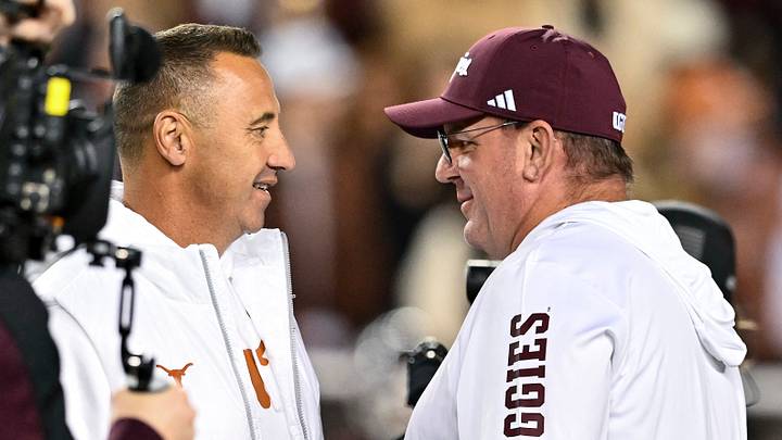 Nov 30, 2024; College Station, Texas, USA; Texas Longhorns head coach Steve Sarkisian and Texas A&M Aggies head coach Mike Elko