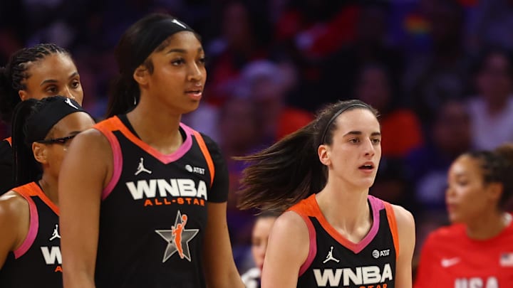 Team WNBA guard Caitlin Clark (right) and Angel Reese