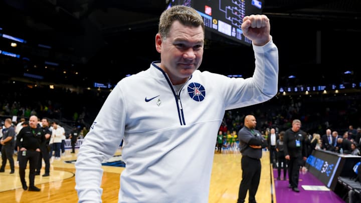 Mar 23, 2025; Seattle, WA, USA;  Arizona Wildcats head coach Tommy Lloyd celebrates after defeating the Oregon Ducks at Climate Pledge Arena. Mandatory Credit: Stephen Brashear-Imagn Images