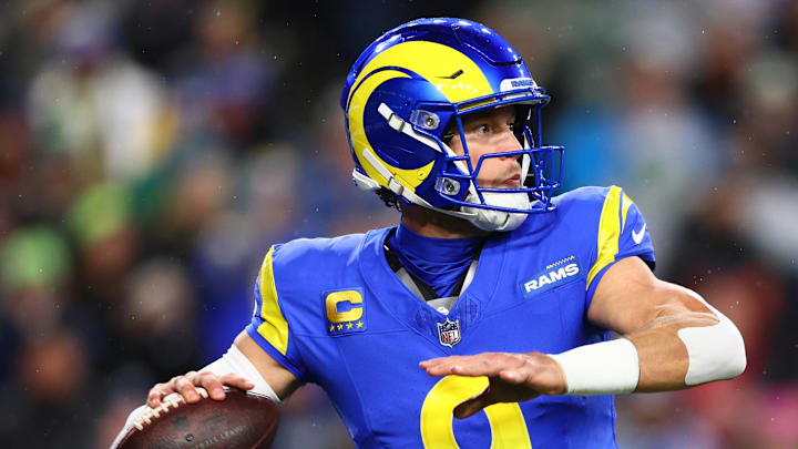 Dec 18, 2025; Seattle, Washington, USA; Los Angeles Rams quarterback Matthew Stafford (9) passes against the Seattle Seahawks in the first half at Lumen Field. Mandatory Credit: Kevin Ng-Imagn Images