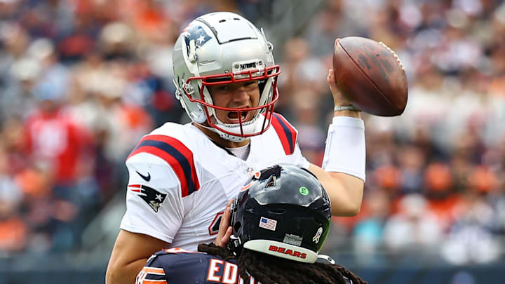 Nov 10, 2024; Chicago, Illinois, USA; Chicago Bears linebacker Tremaine Edmunds (49) tackles New England Patriots quarterback Drake Maye (10) during the first quarter at Soldier Field. Mandatory Credit: Mike Dinovo-Imagn Images