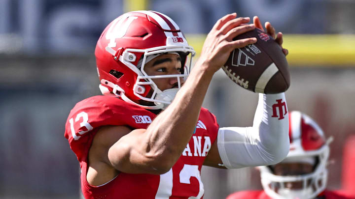 Sep 6, 2025; Bloomington, Indiana, USA; Indiana Hoosiers wide receiver Elijah Sarratt (13) catches a pass during warmups prior to the game against the Kennesaw State Owls at Memorial Stadium. Sep 6, 2025; Bloomington, Indiana, USA; Indiana Hoosiers wide receiver Elijah Sarratt (13) catches a pass during warmups prior to the game against the Kennesaw State Owls at Memorial Stadium.