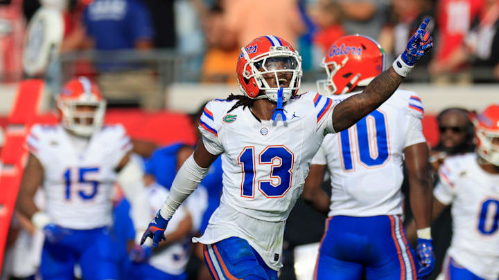 Florida Gators defensive back Aaron Gates (13) celebrates his interception during the second quarter of an NCAA college football matchup Saturday, Nov. 2, 2024 at EverBank Stadium in Jacksonville, Fla. The Georgia Bulldogs defeated the Florida Gators 34-20. [Corey Perrine/Florida Times-Union]