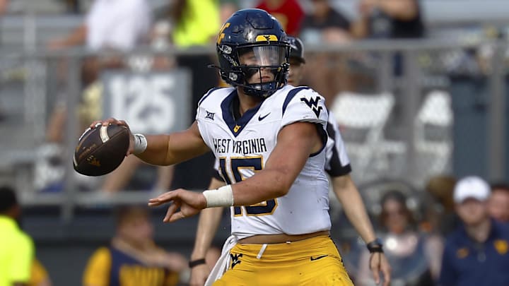 Oct 18, 2025; Orlando, Florida, USA; West Virginia Mountaineers quarterback Scotty Fox Jr. (15) makes a second half pass against the Central Florida Knights at Acrisure Bounce House. Mandatory Credit: Russell Lansford-Imagn Images Oct 18, 2025; Orlando, Florida, USA; West Virginia Mountaineers quarterback Scotty Fox Jr. (15) makes a second half pass against the Central Florida Knights at Acrisure Bounce House. Mandatory Credit: Russell Lansford-Imagn Images