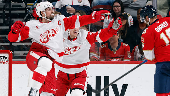 Dylan Larkin celebrate as the Detroit Red Wings score against the Florida Panthers.