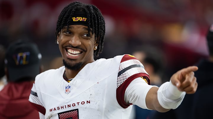 Sep 29, 2024; Glendale, Arizona, USA; Washington Commanders quarterback Jayden Daniels (5) celebrates against the Arizona Cardinals at State Farm Stadium. Mandatory Credit: Mark J. Rebilas-Imagn Images Sep 29, 2024; Glendale, Arizona, USA; Washington Commanders quarterback Jayden Daniels (5) celebrates against the Arizona Cardinals at State Farm Stadium. Mandatory Credit: Mark J. Rebilas-Imagn Images