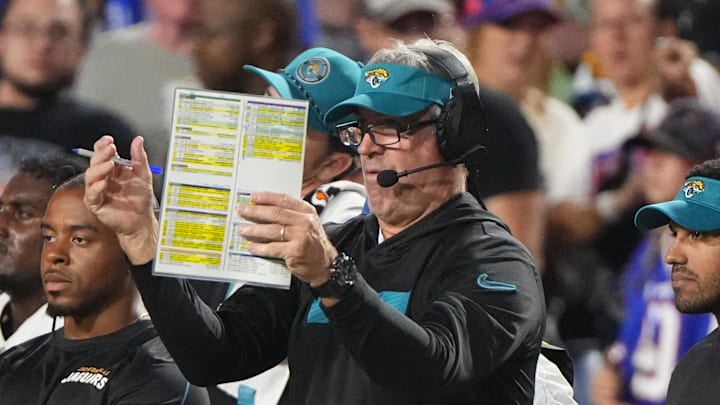 Sep 23, 2024; Orchard Park, New York, USA; Jacksonville Jaguars head coach Doug Pederson looks at his play card during the first half against the Buffalo Bills at Highmark Stadium. Mandatory Credit: Gregory Fisher-Imagn Images