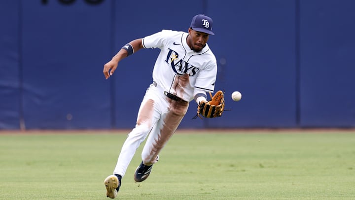 Tampa Bay Rays center fielder Chandler Simpson (14) fields the ball against the Oakland Athletics in the ninth inning at George M. Steinbrenner Field. 