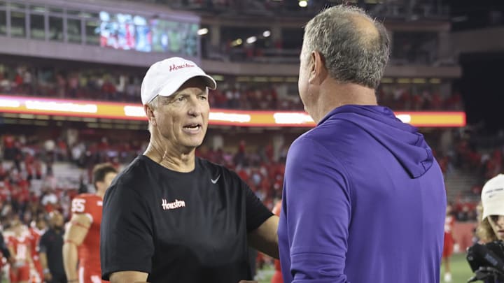 Houston Cougars head coach Willie Fritz greets TCU Horned Frogs head coach Sonny Dykes on the field after the game at TDECU Stadium. 