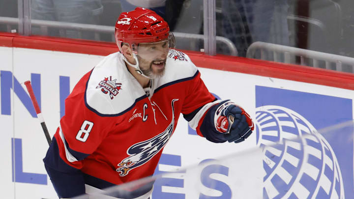 Mar 22, 2026; Washington, District of Columbia, USA; Washington Capitals left wing Alex Ovechkin (8) celebrates with family in the stands after scoring his 1,000th career goal in regular season and playoffs combined against the Colorado Avalanche at Capital One Arena. Mandatory Credit: Amber Searls-Imagn Images