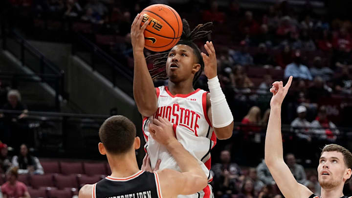 Ohio State Buckeyes guard Meechie Johnson Jr. (1) shoots over Campbell Fighting Camels forward Eric Van Der Heijden (23) during the second half of the NCAA men's basketball game at Value City Arena in Columbus on Friday, Nov. 22, 2024. Ohio State won 104-60. Ohio State Buckeyes guard Meechie Johnson Jr. (1) shoots over Campbell Fighting Camels forward Eric Van Der Heijden (23) during the second half of the NCAA men's basketball game at Value City Arena in Columbus on Friday, Nov. 22, 2024. Ohio State won 104-60.