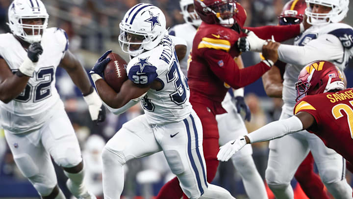 Dallas Cowboys running back Javonte Williams carries the ball against the Washington Commanders.