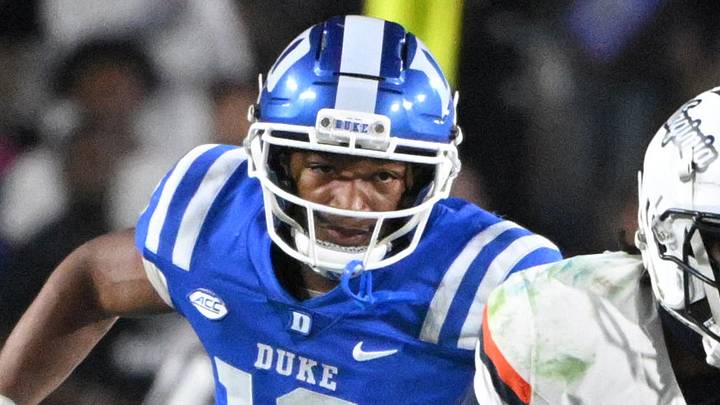 Nov 15, 2025; Durham, North Carolina, USA; Virginia Cavaliers wide receiver Trell Harris (11) runs the ball against Duke Blue Devils defensive end Tyshon Reed (10) during the third quarter at Wallace Wade Stadium. Mandatory Credit: Zachary Taft-Imagn Images Nov 15, 2025; Durham, North Carolina, USA; Virginia Cavaliers wide receiver Trell Harris (11) runs the ball against Duke Blue Devils defensive end Tyshon Reed (10) during the third quarter at Wallace Wade Stadium. Mandatory Credit: Zachary Taft-Imagn Images
