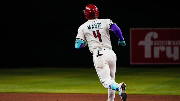 Sep 2, 2025; Phoenix, Arizona, USA; Arizona Diamondbacks second base Ketel Marte (4) runs around the bases after a three run home run in the seventh inning of the game between Arizona Diamondbacks and Texas Rangers at Chase Field. Mandatory Credit: Arianna Grainey-Imagn Images