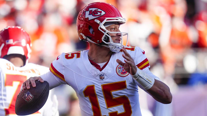 Nov 16, 2025; Denver, Colorado, USA;  Kansas City Chiefs quarterback Patrick Mahomes (15) throws a pass during the first quarter of the game against the Denver Broncos at Empower Field at Mile High. Mandatory Credit: Ron Chenoy-Imagn Images