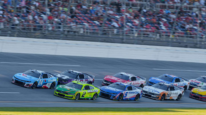 Apr 26, 2025; Talladega, Alabama, USA; NASCAR Cup Series driver Austin Cindric (2) leads the pack into turn one at Talladega Superspeedway. Apr 26, 2025; Talladega, Alabama, USA; NASCAR Cup Series driver Austin Cindric (2) leads the pack into turn one at Talladega Superspeedway.