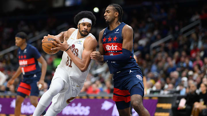 Oct 26, 2024; Washington, District of Columbia, USA; Cleveland Cavaliers center Jarrett Allen (31) drives the ball against Washington Wizards forward Alexandre Sarr (20) during the fourth quarter at Capital One Arena. Mandatory Credit: Reggie Hildred-Imagn Images