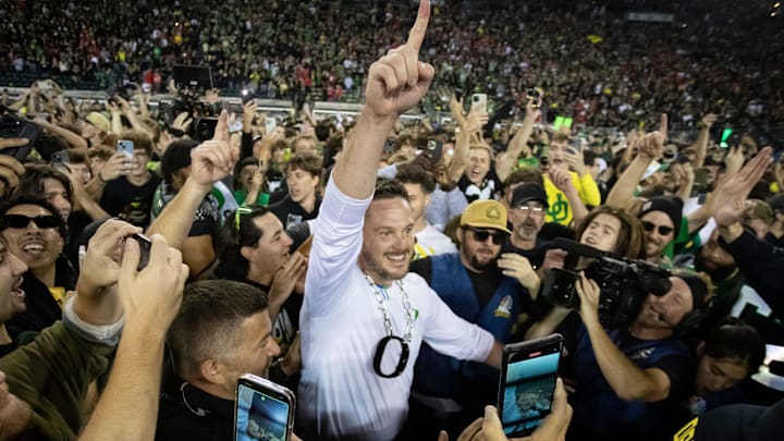 Oregon Ducks head coach Dan Lanning celebrates amid a crowd of fans on the field as the No. 3 Oregon Ducks knock off the No. 2 Ohio State Buckeyes 32-31 Saturday, Oct. 12, 2024 at Autzen Stadium in Eugene, Ore. Oregon Ducks head coach Dan Lanning celebrates amid a crowd of fans on the field as the No. 3 Oregon Ducks knock off the No. 2 Ohio State Buckeyes 32-31 Saturday, Oct. 12, 2024 at Autzen Stadium in Eugene, Ore.