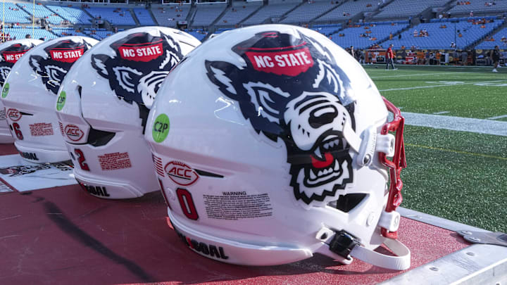 Sep 7, 2024; Charlotte, North Carolina, USA; North Carolina State Wolfpack helmets during pregame activity for the Dukes Mayo Classic against the Tennessee Volunteers at Bank of America Stadium. Mandatory Credit: Jim Dedmon-Imagn Images Sep 7, 2024; Charlotte, North Carolina, USA; North Carolina State Wolfpack helmets during pregame activity for the Dukes Mayo Classic against the Tennessee Volunteers at Bank of America Stadium. Mandatory Credit: Jim Dedmon-Imagn Images
