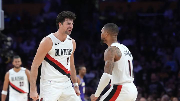 Trail Blazers guard Damian Lillard and forward Deni Avdija celebrate in the final minute against the Los Angeles Lakers Trail Blazers guard Damian Lillard and forward Deni Avdija celebrate in the final minute against the Los Angeles Lakers
