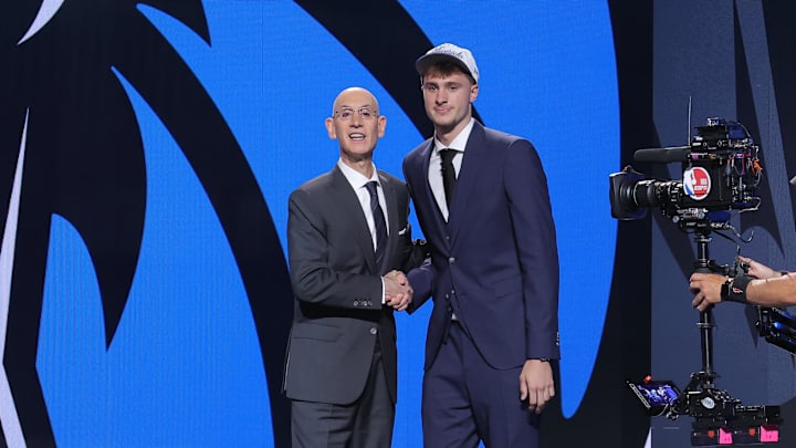Jun 25, 2025; Brooklyn, NY, USA;  Cooper Flagg poses with NBA commissioner Adam Silver after being selected as first overall by the Dallas Mavericks in the first round of the 2025 NBA Draft at Barclays Center. Mandatory Credit: Brad Penner-Imagn Images