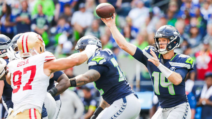 Sep 7, 2025; Seattle, Washington, USA; Seattle Seahawks quarterback Sam Darnold (14) passes against the San Francisco 49ers during the third quarter at Lumen Field.