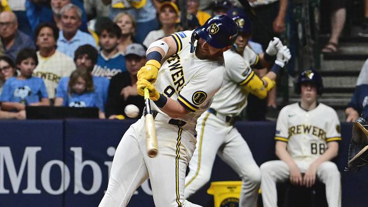 Oct 12, 2026; Milwaukee, Wisconsin, USA;  Milwaukee Brewers first baseman Jake Bauers (9) hits an RBI single against the Los Angeles Dodgers during the eighth inning in game two of the NLCS for the 2026 MLB Playoffs at American Family Field.  Mandatory Credit: Benny Sieu-Imagn Images