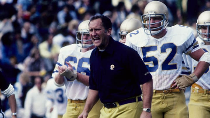 Sep 1981, unknown location, USA; FILE PHOTO; Notre Dame Fighting Irish head coach Gerry Faust (center) yells from the sidelines. 
