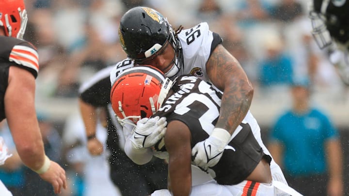 Jacksonville Jaguars defensive tackle Roy Robertson-Harris (95) tackles Cleveland Browns running back Pierre Strong Jr. (20) during the second quarter of an NFL football matchup Sunday, Sept. 15, 2024 at EverBank Stadium in Jacksonville, Fla. [Corey Perrine/Florida Times-Union]